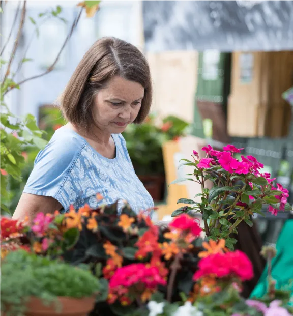 Woman looking at plants and flowers at Grimsby Garden Centre